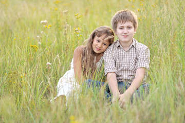 Small Brother and sister in summer nature