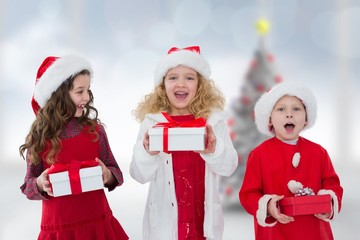 Composite image of cute children with gifts