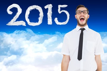 Composite image of geeky young businessman shouting loudly