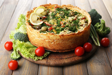 Vegetable pie with broccoli, peas, tomatoes and cheese
