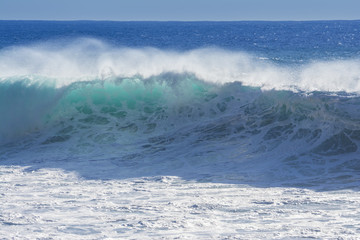 Waves breaking on the shore of Madeira