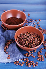 Two bowls of ground coffee and coffee beans