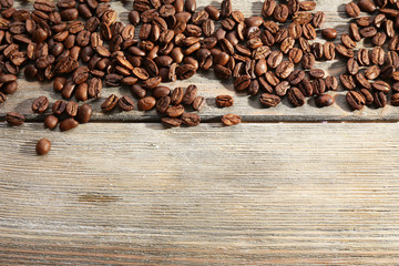 Coffee beans on wooden background