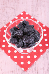 Prunes in glass bowl