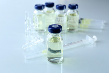 Vaccine in vial with syringe