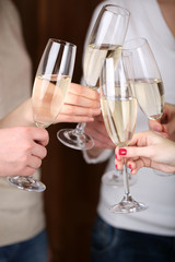 Woman hands with glasses of champagne