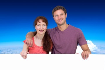 Composite image of couple looking at the camera