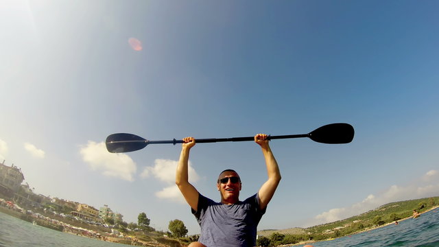 Successful sport man kayaking