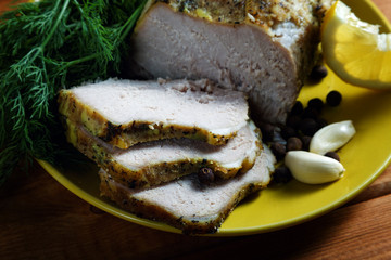 Boiled pork with pepper an onions and garlic on a plate