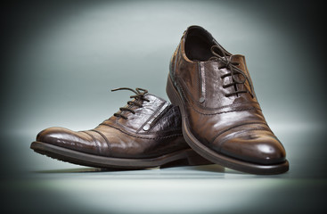 classic expensive leather shoes on abstract background