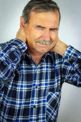 Senior Man Suffering With Severe Neck Pain