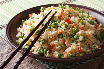 Asian fried rice with egg and vegetables closeup, Horizontal