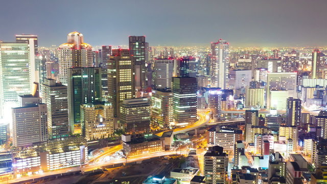 Timelapse video of Osaka in Japan at night, zooming in