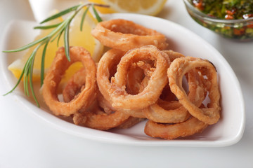 Squid  rings with lemon and rosemary