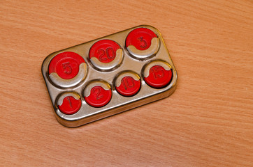 old coin holder on wooden table