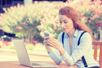 woman holding, using smart, mobile phone and computer