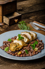 Roasted chicken breast with herbs and stewed beans
