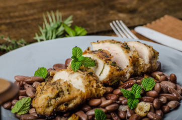 Roasted chicken breast with herbs and stewed beans