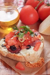 Cheese sandwich with tomato and olives