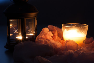 Candles naturmort in dark on pink drape