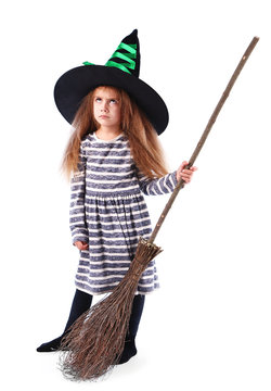 Little girl Witch with broom in hat isolated on white