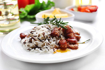 Tasty rice with meat served on table, close-up