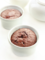 Hot chocolate pudding with fondant centre on white table