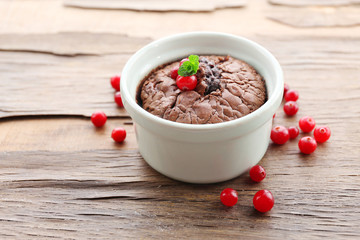 Hot chocolate pudding with fondant centre on table, close-up