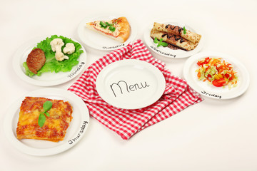 Daily menu. Plates with food on table
