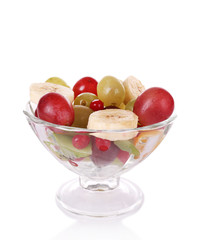 Mix of fruit in glass saucer isolated on white