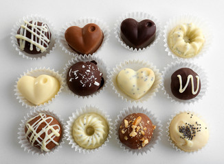 Delicious chocolate candies isolated on white