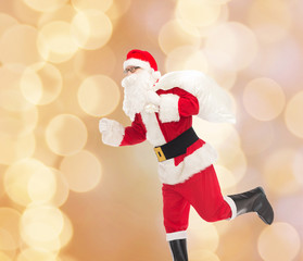 man in costume of santa claus with bag