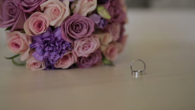 Wedding rings and wedding bouquet.Wedding rings on the bouquet.