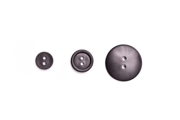 Black plastic buttons with two pins on White Isolate Background