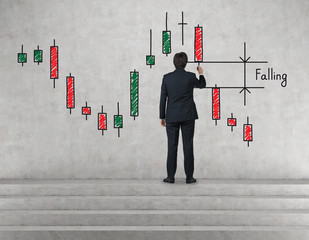 businessman drawing candlestick chart
