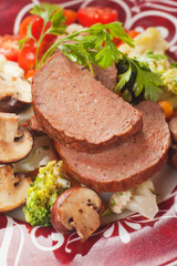 Classic meatloaf with mushrooms and vegetables