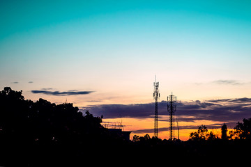 sunset sky with silhouette antenna