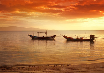 boats in sea at sunset, beautiful sunset