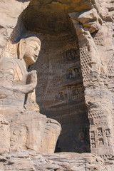 Obraz premium stone Buddha sculpture in the cave