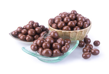 chocolate balls. chocolate balls in bowl on a background
