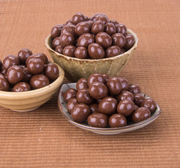 chocolate balls. chocolate balls in bowl on a background
