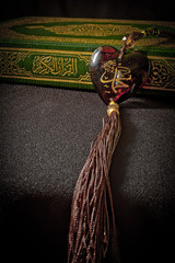 Heart shape stone with Arabic script and Quran