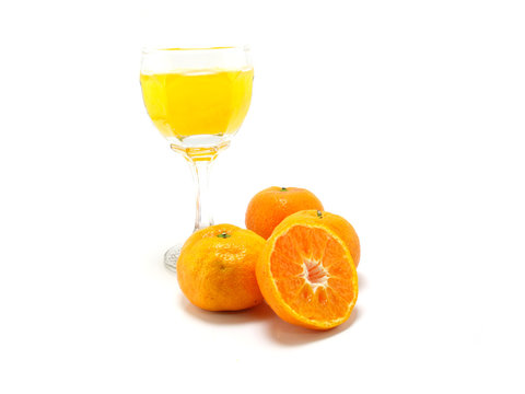orange juice and slices on white background