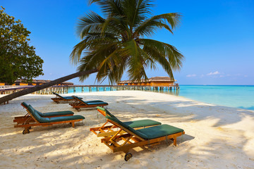 Fototapeta na wymiar Loungers on Maldives beach