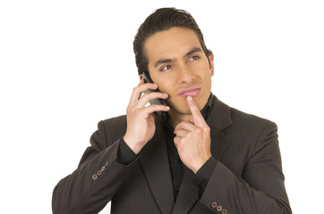 handsome young man wearing a suit posing using cell phone mobile