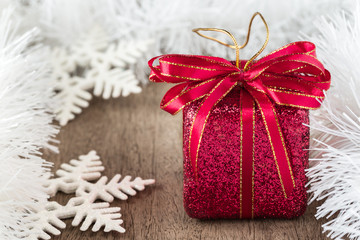 Red gift box on wooden background