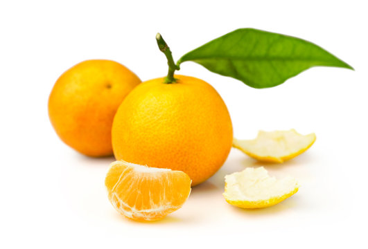 ripe tangerines with fresh leaves