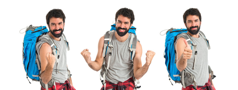 Lucky backpacker over isolated white background