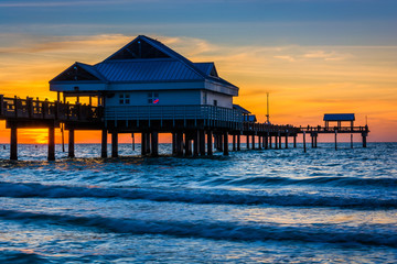 Fishing pier in the Gulf of Mexico at sunset,  Clearwater Beach, - obrazy, fototapety, plakaty