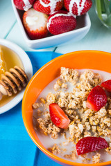 Breakfast with mueasli with fresh fruit and orange juice